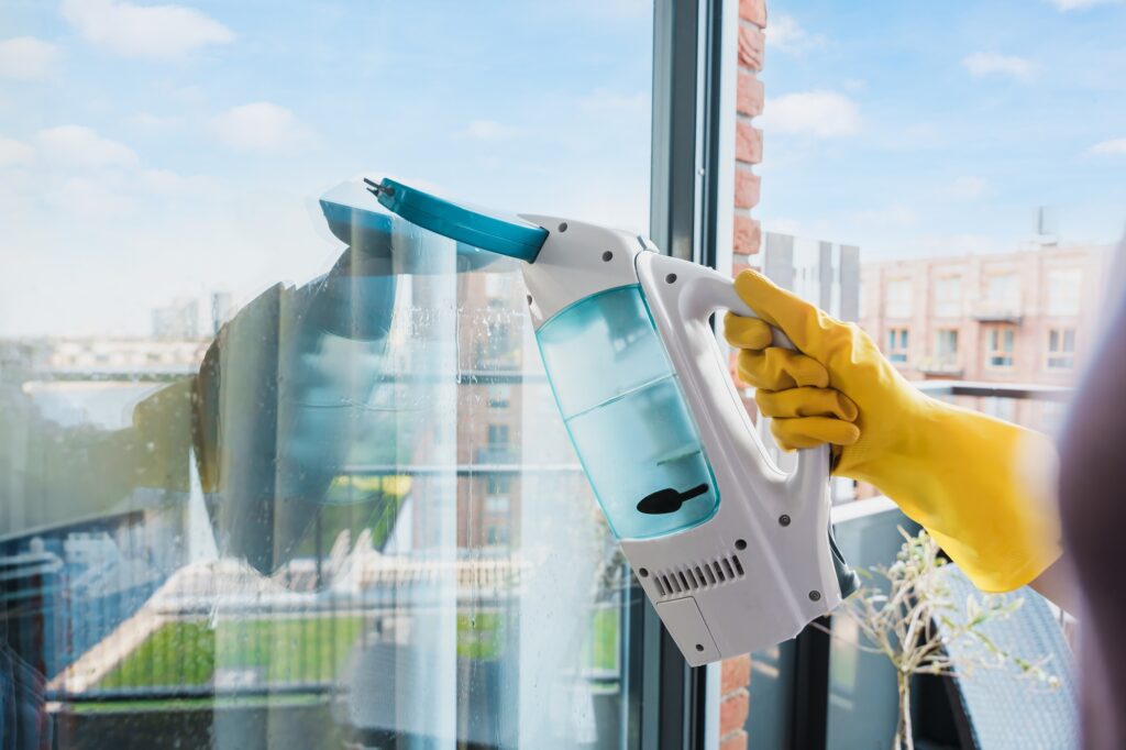 Deep Cleaning Glass Windows With A Vacuum Squeegee
